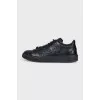 Black leather lace-up sneakers