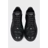 Black leather lace-up sneakers