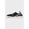 Textile slip-ons with a signature print