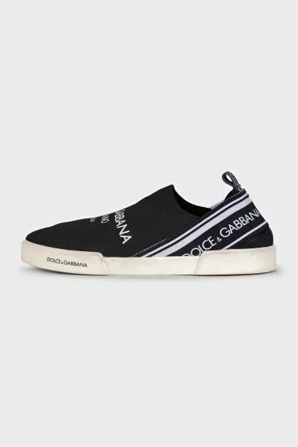 Textile slip-ons with a signature print
