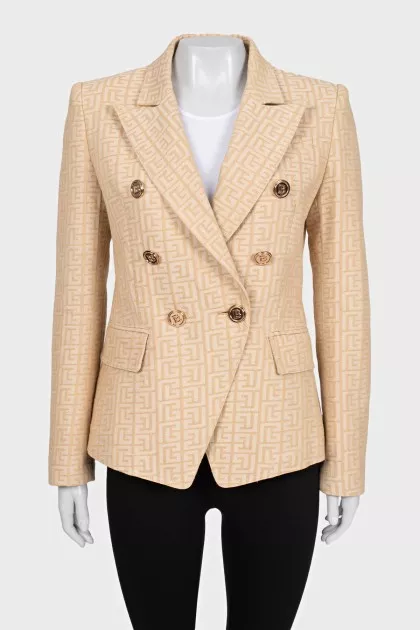 Fitted beige jacket with signature print