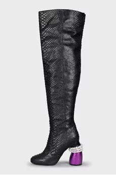 Snakeskin over-the-knee boots with an accent heel
