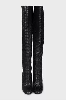 Snakeskin over-the-knee boots with an accent heel