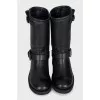 Black leather boots with straps