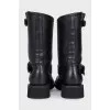 Black leather boots with straps