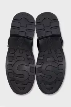 Black leather boots with straps