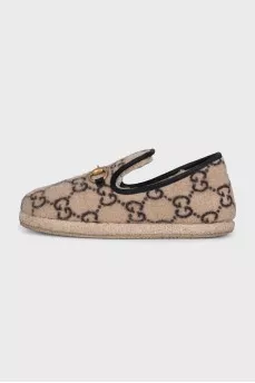 Insulated slip-ons with a signature monogram