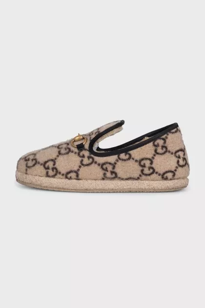 Insulated slip-ons with a signature monogram