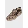 Insulated slip-ons with a signature monogram