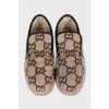 Insulated slip-ons with a signature monogram
