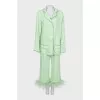 Green suit with removable feathers on the legs