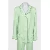 Green suit with removable feathers on the legs