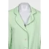 Green suit with removable feathers on the legs