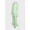 Green suit with removable feathers on the legs