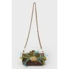 Bag with feathers on a metal chain