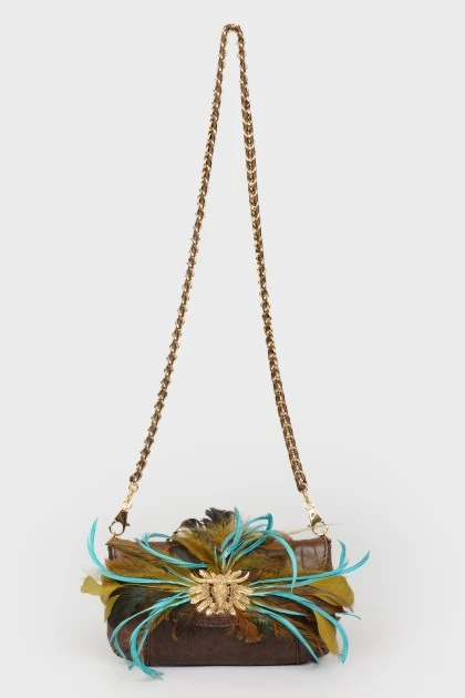 Bag with feathers on a metal chain