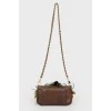 Bag with feathers on a metal chain