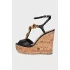 Black sandals with metallic flowers