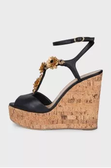 Black sandals with metallic flowers