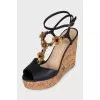 Black sandals with metallic flowers