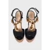 Black sandals with metallic flowers