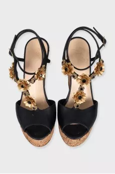 Black sandals with metallic flowers