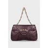 Purple bag with a gold clasp