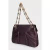 Purple bag with a gold clasp