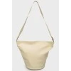 A bag with a round bottom on a belt