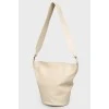 A bag with a round bottom on a belt