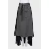 Button-down skirt with an asymmetrical hem