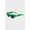 Green oval frame sunglasses