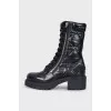 Black leather boots with tag