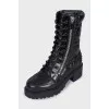 Black leather boots with tag