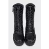 Black leather boots with tag