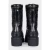 Black leather boots with tag