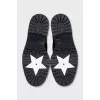 Black leather boots with tag