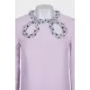 Purple dress decorated with sequins and rhinestones