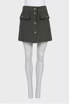 Green skirt with gold buttons