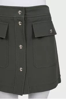 Green skirt with gold buttons
