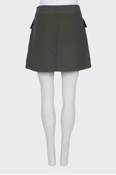 Green skirt with gold buttons