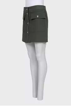 Green skirt with gold buttons