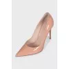 Patent leather pumps made of beige leather