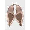 Patent leather pumps made of beige leather