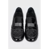Black leather loafers with buckle