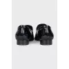 Black leather loafers with buckle