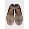 Black leather loafers with buckle