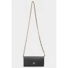 Bag on a metal chain with skin