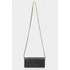 Bag on a metal chain with skin