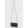 Bag on a metal chain with skin